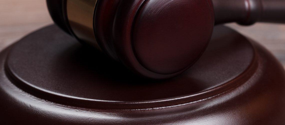 judge gavel close-up on the brown wooden table